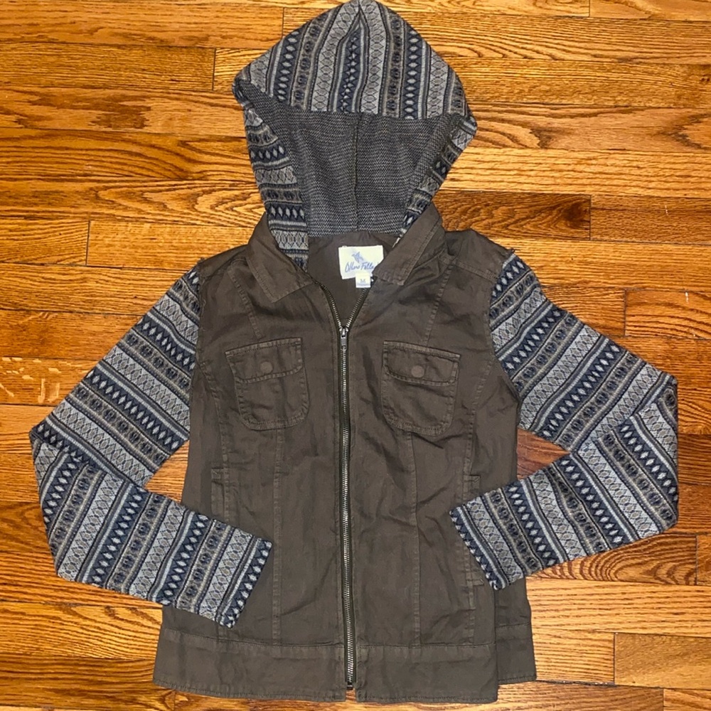 Medium green zip up utility jacket with hood and pockets.